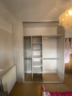 Light artwood wardrobe with hanging and shelves, fitted in Norton